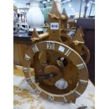 A WOODEN MECHANICAL CLOCK