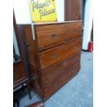 A BRASS EDGED AND INLAID TEAK TWO PART CAMPAIGN CHEST OF DRAWERS