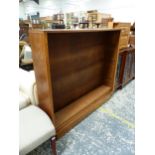 AN OAK OPEN BOOK CASE WITH FOUR FIXED SHELVES