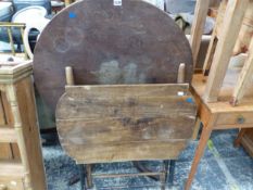 AN OAK TRIPOD TABLE TOGETHER WITH A PINE THREE PLANK TOPPED TABLE FOLDING ON EBONISED LEGS