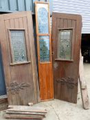 A PAIR OF PITCH PINE DOORS WITH CENTRE PANEL AND FRAME, ALL WITH LEADED GLASS WINDOWS ( FOR