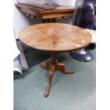 A MAHOGANY CIRCULAR TILT TOP TRIPOD TABLE. Dia. 64 x H 61cms.