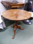 A MAHOGANY CIRCULAR TILT TOP TRIPOD TABLE. Dia. 64 x H 61cms.