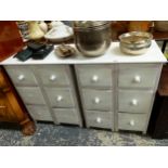 A PAIR OF WHITE PAINTED BEDSIDE CHESTS, EACH WITH TWO BANKS OF THREE DRAWERS