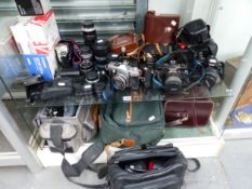 A COLLECTION OF CAMERAS, LENSES AND CARRYING BAGS