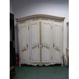 A FRENCH WHITE PAINTED ARMOIRE, THE FOUR DOORS WITH CENTRAL CARVED AND GILT FOLIAGE. W 205 x D 56