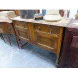 AN OAK SIDEBOARD WITH TWO DRAWERS OVER CUPBOARDS AND BARLEY TWIST LEGS