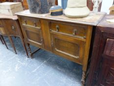 AN OAK SIDEBOARD WITH TWO DRAWERS OVER CUPBOARDS AND BARLEY TWIST LEGS