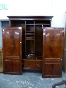 A MAHOGANY TWO DOOR WARDROBE WITH SHELVING, HANGING SPACE AND A LONG DRAWER.