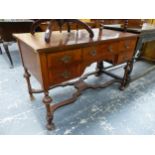 A MAHOGANY FIVE DRAWER SIDE TABLE ON TURNED LEGS JOINED BY A WAVY STRETCHER