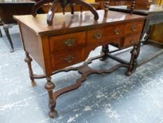 A MAHOGANY FIVE DRAWER SIDE TABLE ON TURNED LEGS JOINED BY A WAVY STRETCHER