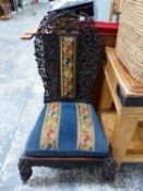 AN ANGLO-INDIAN PIERCED AND CARVED HARD WOOD CHAIR WITH NEEDLEWORK PANEL CENTRAL TO THE BACK AND