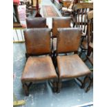 A SET OF FOUR LEATHER UPHOLSTERED OAK DINING CHAIRS