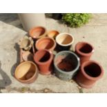 THREE SMALL CHIMNEYS AND A QUANTITY OF GARDEN POTS