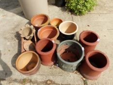 THREE SMALL CHIMNEYS AND A QUANTITY OF GARDEN POTS