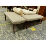 A PAIR OF GREY UPHOLSTERED DOUBLE STOOLS ON MAHOGANY TAPERING SQUARE SECTIONED SABRE LEGS