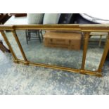 A TRIPLE PLATE MIRROR IN GILT ARCHITECTURAL FRAME