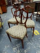 A SET OF THREE MAHOGANY SHIELD BACKED CHAIRS