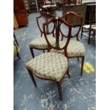 A SET OF THREE MAHOGANY SHIELD BACKED CHAIRS