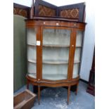 A SATIN WOOD BANDED MAHOGANY DISPLAY CABINET, THE SERPENTINE FRONTED DOOR FLANKED BY QUARTER ROUND