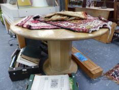 AN OAK CIRCULAR TABLE ON HEXAGONAL COLUMN AND ROUND PLINTH. Dia. 120cms.