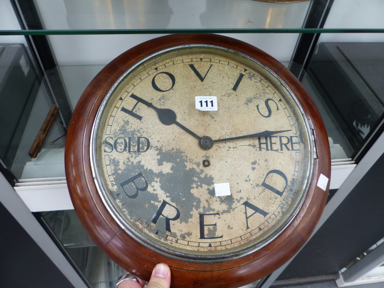 A MAHOGANY FRAMED WALL TIMEPIECE INSCRIBED HOVIS BREAD SOLD HERE