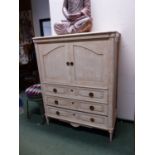 A CREAM PAINTED TV CABINET WITH THREE LONG DRAWERS BELOW ITS DOORS. W 120 x D 56 x H 150cms.