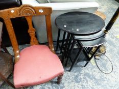 A LATE 19th C. OAK NURSING CHAIR TOGETHER WITH A NEST OF THREE EBONISED TABLES