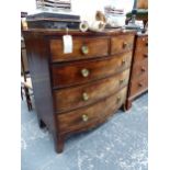 A MAHOGANY BOW FRONT CHEST OF TWO SHORT AND THREE LONG DRAWERS, EACH WITH BRASS ROSETTE KNOBS