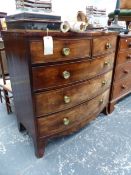 A MAHOGANY BOW FRONT CHEST OF TWO SHORT AND THREE LONG DRAWERS, EACH WITH BRASS ROSETTE KNOBS