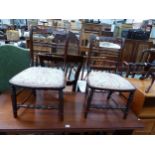 A PAIR OF SIMULATED ROSEWOOD BOUDOIR CHAIRS, BOTH OF THE TOP RAILS CENTRED BY BRASS ROSETTE