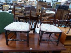 A PAIR OF SIMULATED ROSEWOOD BOUDOIR CHAIRS, BOTH OF THE TOP RAILS CENTRED BY BRASS ROSETTE