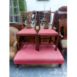 A PAIR OF MAHOGANY CHIPPENDALE TASTE DINING CHAIRS TOGETHER WITH A RED UPHOLSTERED STOOL ON MAHOGANY