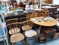 AN ERCOL DROP FLAP OVAL TABLE TOGETHER WITH FIVE CHAIRS