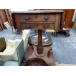 A MAHOGANY FLAP TOP TWO DRAWER TABLE ON BALUSTER COLUMN AND FOUR SCROLL FEET