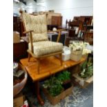 A BEECH ARMCHAIR WITH BUTTONED BACK CUSHION TOGETHER WITH A PINE TABLE. W 122 x D 68 x H 74cms.