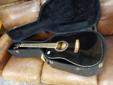 A LARGE ACCUSTIC GUITAR IN CARRY CASE