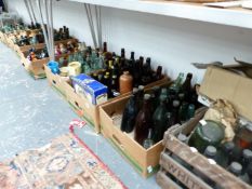 A VERY LARGE COLLECTION OF VINTAGE GLASS AND POTTERY BEER BOTTLES, JUGS, CRATES, AND OTHER BOTTLES