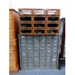 A GREY PAINTED METAL STORAGE CABINET OF 60 DRAWERS TOGETHER WITH A WOODEN 12 DRAWER SHOP CABINET