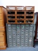 A GREY PAINTED METAL STORAGE CABINET OF 60 DRAWERS TOGETHER WITH A WOODEN 12 DRAWER SHOP CABINET