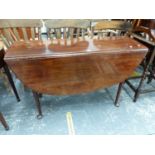 A MAHOGANY OVAL DROP FLAP DINING TABLE ON TAPERING CYLINDRICAL LEGS WITH PAD FEET