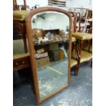 A MAHOGANY FRAMED BEVELLED GLASS MIRROR. 133 x 68cms.