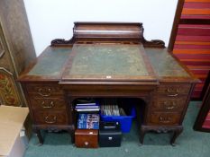 A VICTORIAN MAHOGANY PEDESTAL DESK. THE CENTRAL LEATHER INSET SLOPING TOWARDS A KNEEHOLE FLANKED