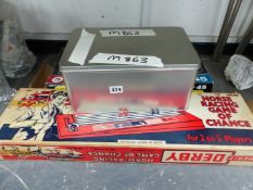 A 007 BOXED GROUP OF JAMES BOND CDS, A MORTAR GUN, AND A VINTAGE MERIT DERBY HORSE RACING GAME.