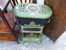 A PETROLUX GREEN AND BLACK ENAMELLED STOVE