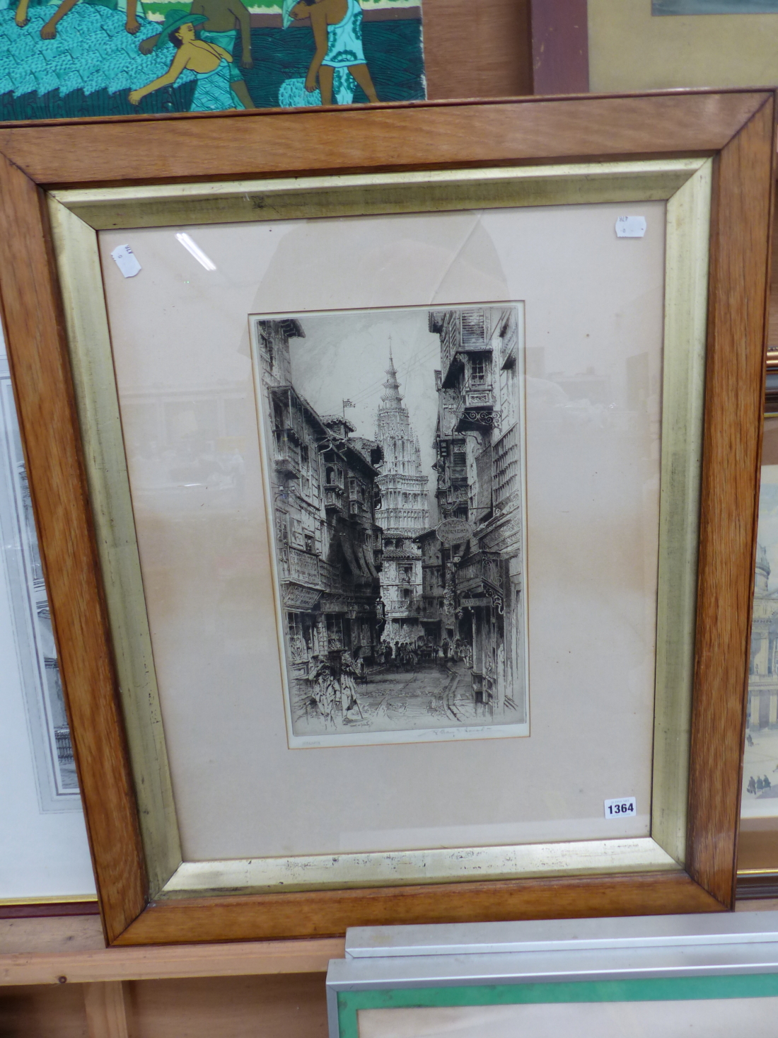 AN EARLY 20th CENTURY ETCHING OF A STREET IN TOLEDO, INDISTINCT PENCIL SIGNATURE, 42 x 24cm,