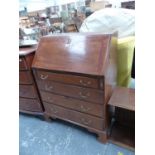 A MAHOGANY BUREAU WITH FOUR GRADED LONG DRAWERS