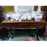 A CROSS BANDED MAHOGANY SQUARE PIANO NOW CONVERTED WITH THREE FRONT DRAWERS. W 167 x D 62 x H