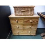 A VICTORIAN STRIPPED PINE SMALL CHEST OF FOUR DRAWERS.