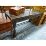 AN OAK REFECTORY TABLE WITH FLUTED APRON AND BALUSTER LEGS. W. 148 x D. 61 x H. 80.5cms